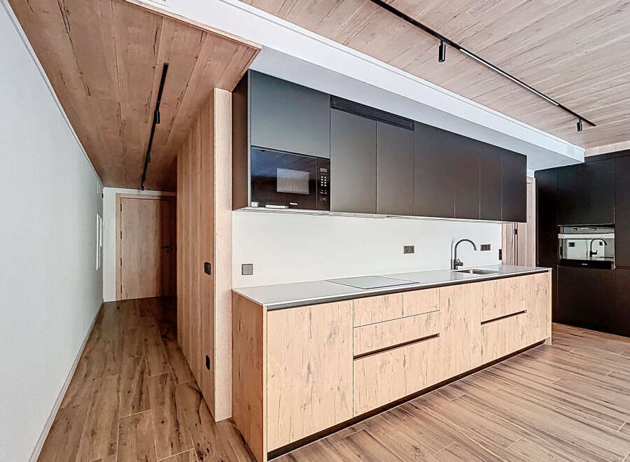 This modern kitchen boasts sleek design and functionality.