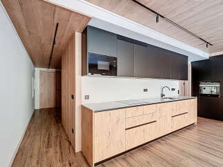 This modern kitchen boasts sleek design and functionality.