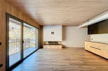Experience luxury living in this stunning property featuring a modern fireplace and a sleek kitchen design.