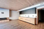 This modern kitchen boasts sleek cabinetry and a minimalist design, perfect for contemporary living.
