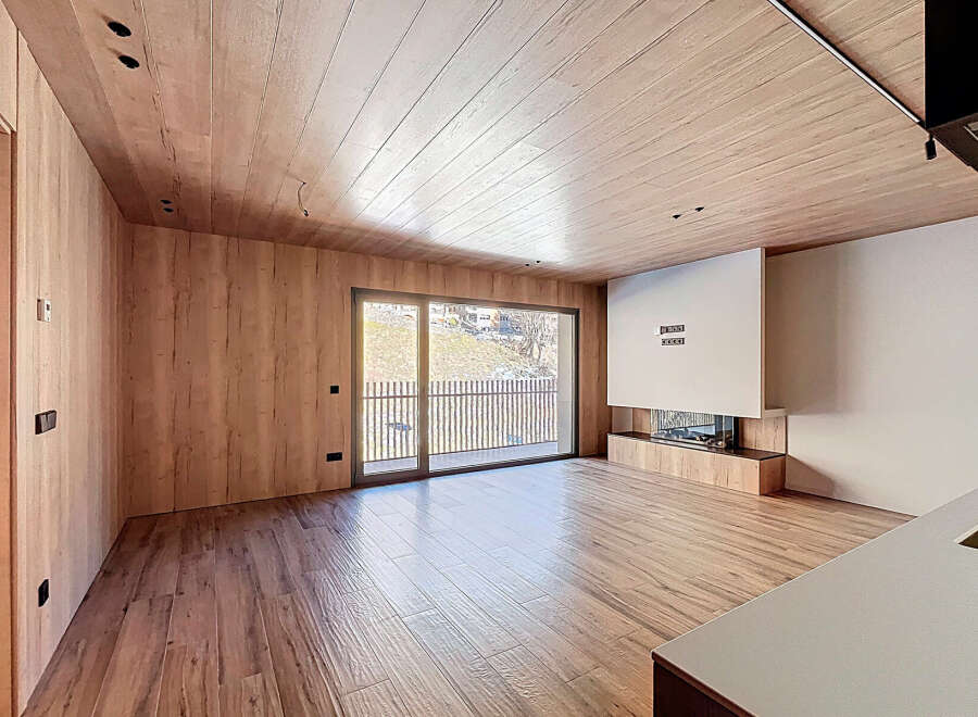 Experience modern luxury in this stunning property, featuring exquisite wood paneling and flooring that exudes warmth and sophistication.