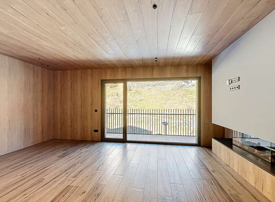 This stunning property boasts a modern interior with a warm and inviting ambiance.