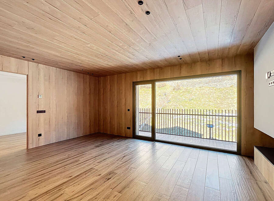 Step into modern elegance with this stunning property, featuring exquisite wood paneling throughout.