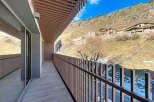 Enjoy breathtaking mountain views from this stunning balcony.