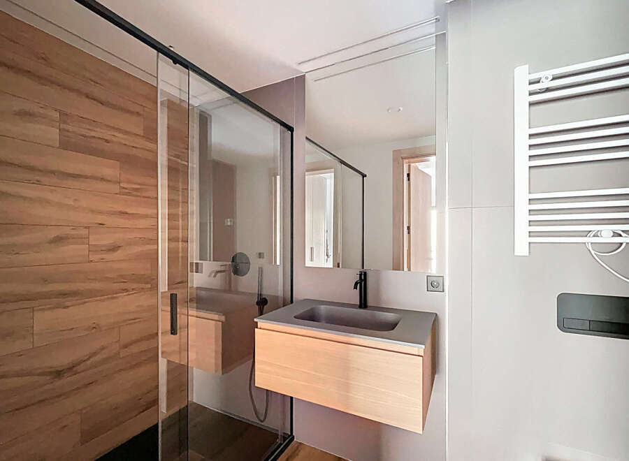 Step into modern elegance with this stunning bathroom design.