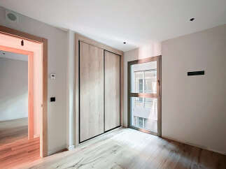Discover this beautifully designed property featuring a modern interior with light wood flooring and a spacious layout.