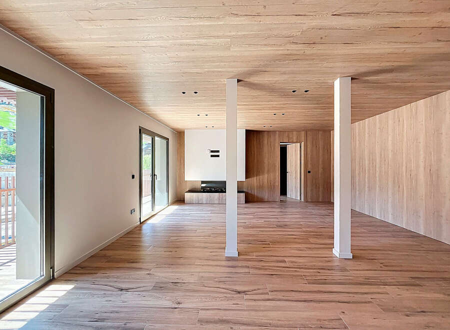 Step into this stunning modern living space, featuring a seamless blend of natural wood elements.