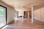 Step into this stunning modern living space, featuring a seamless blend of natural wood elements.