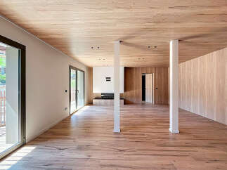 Step into this stunning modern living space, featuring a seamless blend of natural wood elements.