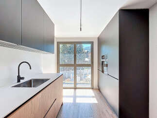 Experience modern elegance in this stunning kitchen! Featuring sleek cabinetry, a stainless steel sink, and a minimalist design, this space is perfect for both cooking and entertaining.
