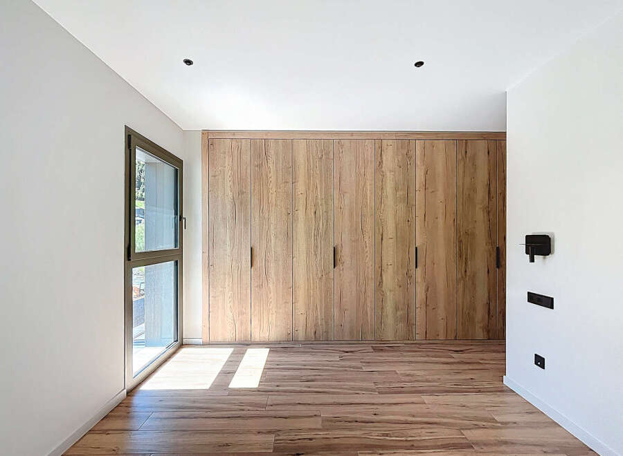 This stunning property boasts a modern interior with a focus on natural materials.