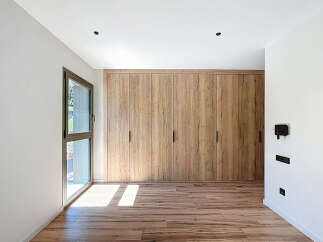 This stunning property boasts a modern interior with a focus on natural materials.