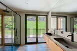 Experience luxury living in this stunning bathroom featuring a sleek, modern design.