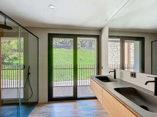 Experience luxury living in this stunning bathroom featuring a sleek, modern design.