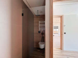 Step into modern luxury with this stunning property featuring a sleek, contemporary bathroom design.