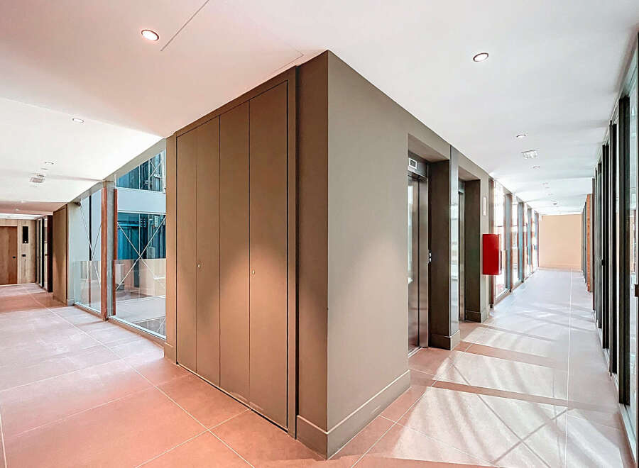 Step into luxury with this stunning property featuring a modern hallway design.