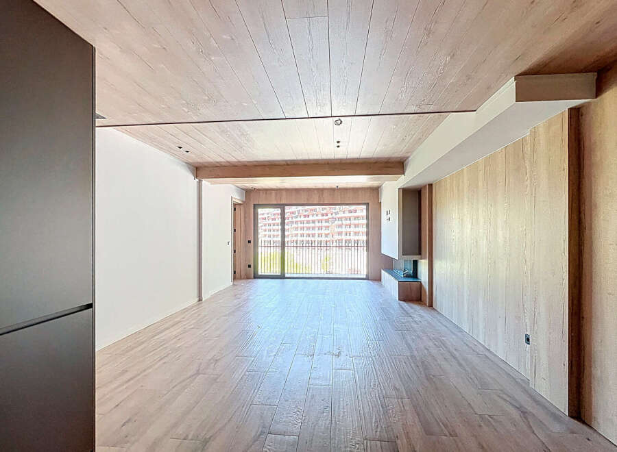 This stunning property boasts an open-plan living area with large windows offering breathtaking views.