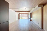 This stunning property boasts an open-plan living area with large windows offering breathtaking views.