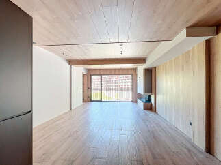 This stunning property boasts an open-plan living area with large windows offering breathtaking views.