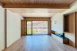 This stunning property boasts a spacious open-plan living area with large windows offering breathtaking mountain views.