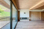 Stunning modern living space with floor-to-ceiling windows offering breathtaking views.