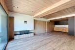 Stunning open-plan living space with a modern fireplace and sleek kitchen.