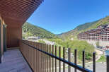 Stunning mountain views from this modern apartment's private balcony.