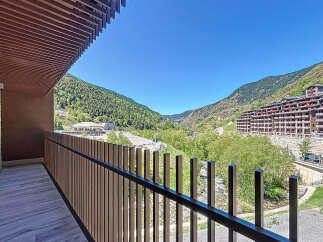 Stunning mountain views from this modern apartment's private balcony.