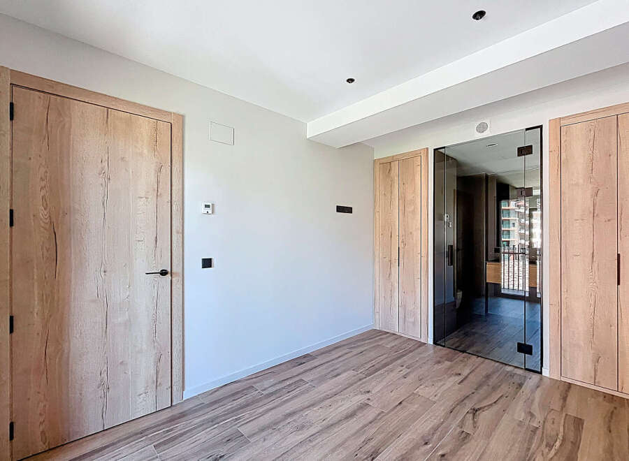 This stunning property boasts a spacious and bright interior with high-quality wooden flooring and doors.