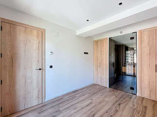 This stunning property boasts a spacious and bright interior with high-quality wooden flooring and doors.