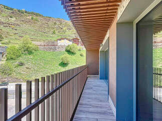 This stunning property boasts a spacious balcony with breathtaking mountain views.