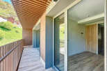 This stunning property boasts a spacious balcony with breathtaking mountain views and a modern, sleek interior.
