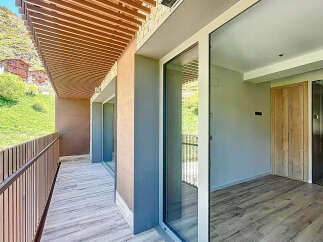 This stunning property boasts a spacious balcony with breathtaking mountain views and a modern, sleek interior.