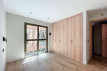 Bright and airy bedroom with large window offering ample natural light.