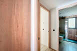 This stunning property boasts a modern design with sleek wooden finishes throughout.