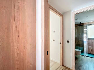 This stunning property boasts a modern design with sleek wooden finishes throughout.