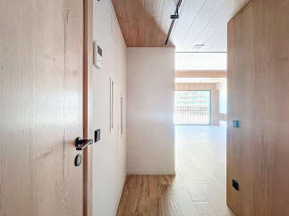 This stunning apartment boasts a spacious open-plan living area with large windows offering breathtaking views.