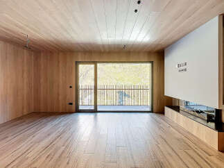 This stunning property boasts a modern interior with exquisite wooden finishes throughout.
