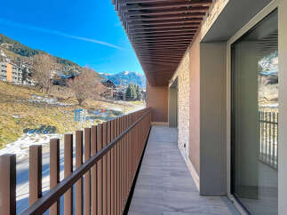 Enjoy breathtaking mountain views from this stunning balcony.