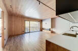 This stunning modern property boasts a seamless blend of natural wood elements and contemporary design.