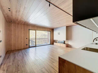 This stunning modern property boasts a seamless blend of natural wood elements and contemporary design.