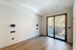 This modern room features a sleek design with a focus on natural light and contemporary finishes.