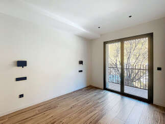 This modern room features a sleek design with a focus on natural light and contemporary finishes.