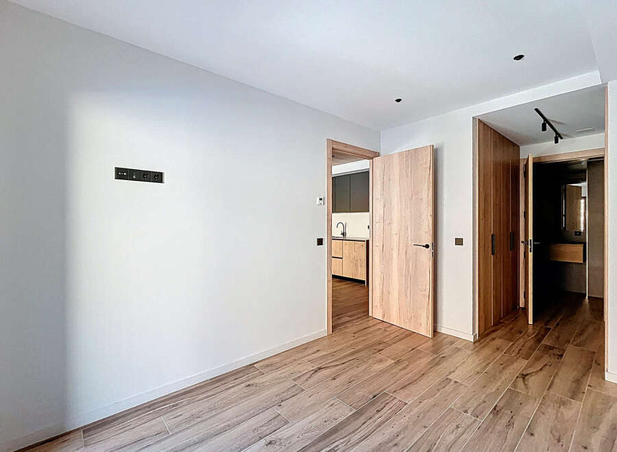 Step into this beautifully designed space, featuring elegant wooden flooring and a neutral color palette that creates a sense of warmth and sophistication.