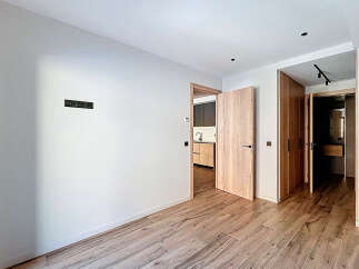 Step into this beautifully designed space, featuring elegant wooden flooring and a neutral color palette that creates a sense of warmth and sophistication.