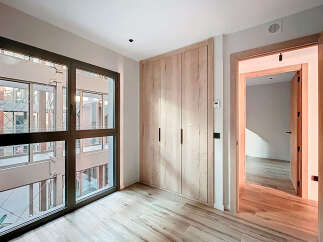 Discover the elegance of this modern property, featuring a spacious interior with natural light pouring in through large windows.