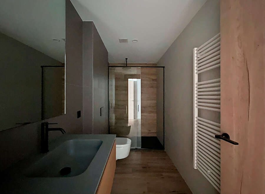 Step into a modern bathroom oasis, featuring sleek design elements and high-end finishes.