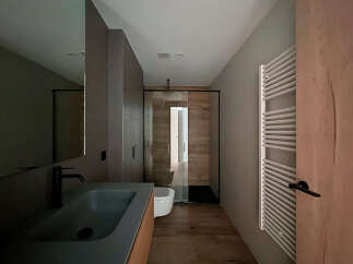 Step into a modern bathroom oasis, featuring sleek design elements and high-end finishes.