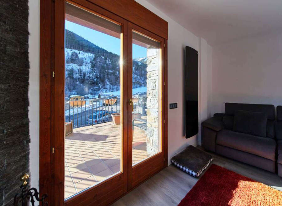 This stunning property boasts breathtaking mountain views from its large windows and private balcony.