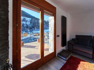 This stunning property boasts breathtaking mountain views from its large windows and private balcony.